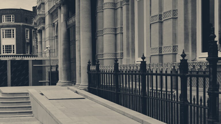 A new paved wheelchair ramp sweeps up beside steps to a columned museum entrance in Hull
