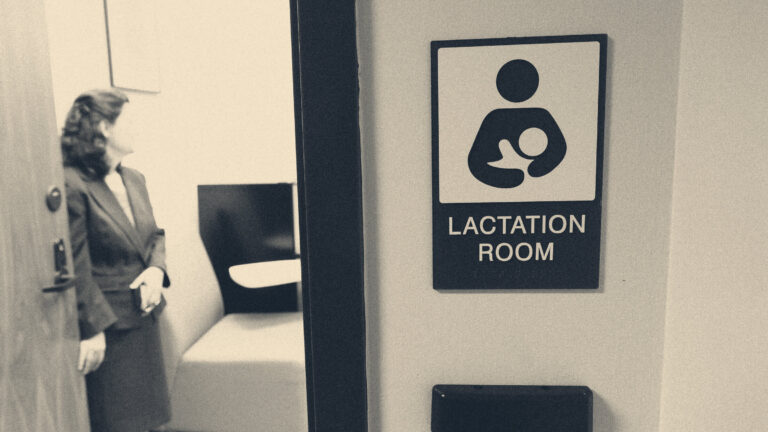 A woman in business dress entering a private lactation room at an office, its door sign in the foreground.